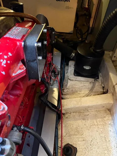  Yacht Photos Pics Engine compartment of a 1986 Grand Banks 36 Classic boat, featuring red engine components.