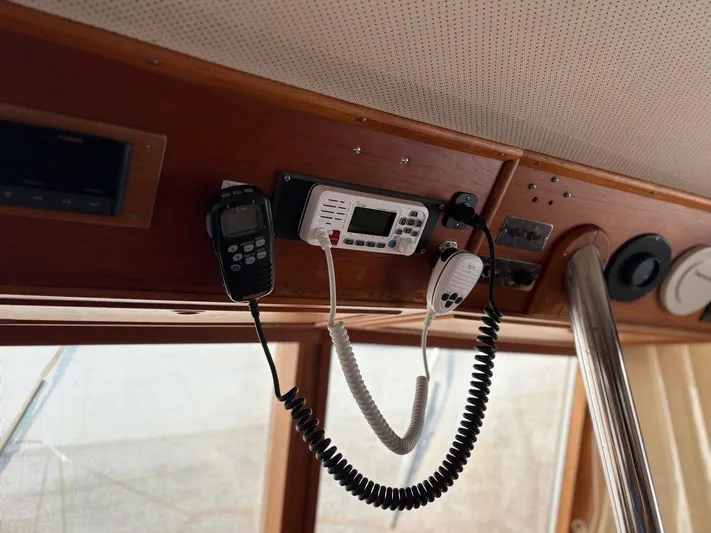  Yacht Photos Pics Interior of 1986 Grand Banks 36 Classic with communication equipment and wooden paneling.