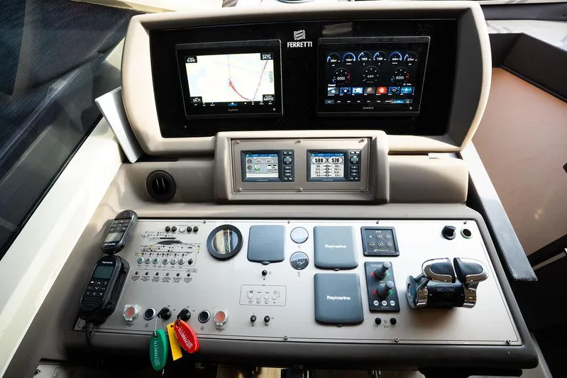  Yacht Photos Pics Control panel of a 2009 Ferretti Yachts 470 with navigation and communication equipment.
