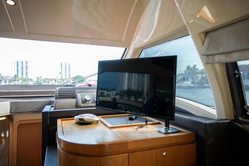  Yacht Photos Pics Interior of 2009 Ferretti Yachts 470 with TV and cityscape view.