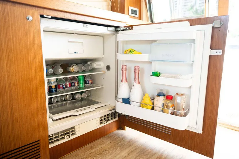  Yacht Photos Pics Open refrigerator on 2009 Ferretti Yachts 470, stocked with drinks and condiments.