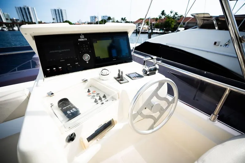  Yacht Photos Pics 2009 Ferretti Yachts 470 helm with modern controls and waterfront view.