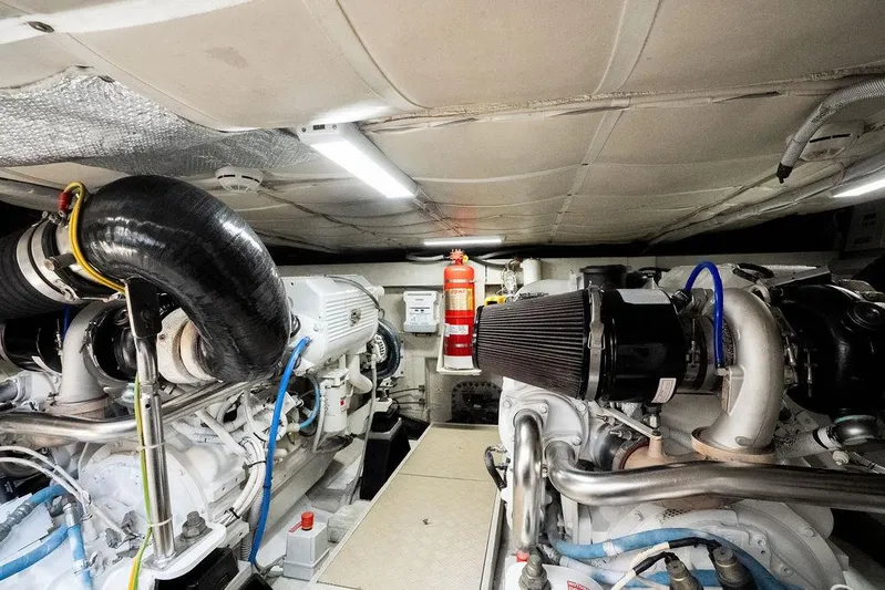  Yacht Photos Pics Engine room of 2009 Ferretti Yachts 470, featuring dual engines and fire extinguisher.