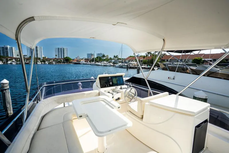  Yacht Photos Pics 2009 Ferretti Yachts 470, luxurious flybridge view, marina backdrop, sunny day.