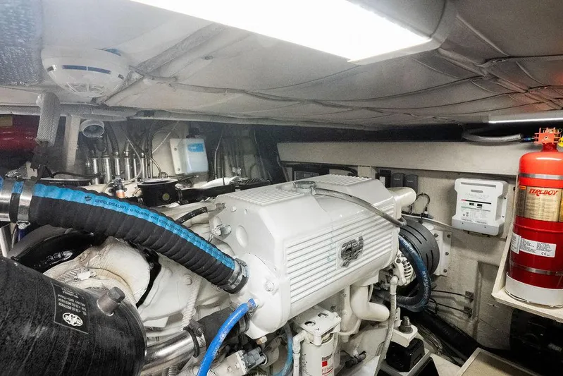  Yacht Photos Pics Engine room of a 2009 Ferretti Yachts 470, featuring mechanical components and safety equipment.