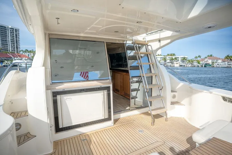  Yacht Photos Pics 2009 Ferretti Yachts 470 deck with modern design, featuring stairs and waterfront view.