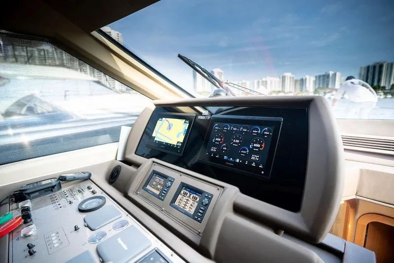  Yacht Photos Pics Control panel of 2009 Ferretti Yachts 470 with navigation screens and city skyline view.