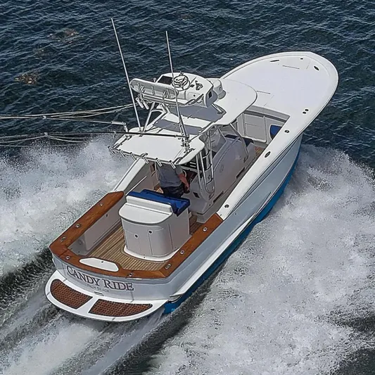 Candy Ride Yacht Photos Pics 2011 Winter Custom Yachts 29 boat cruising on water, aerial view.