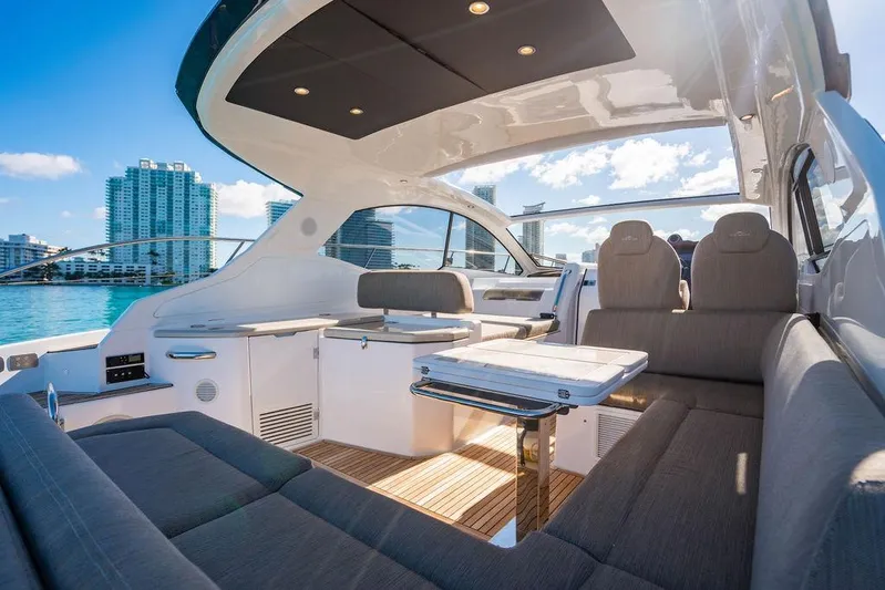 Relax Josephine Yacht Photos Pics Luxurious 2022 Azimut Atlantis 45 yacht interior with modern seating and cityscape view.