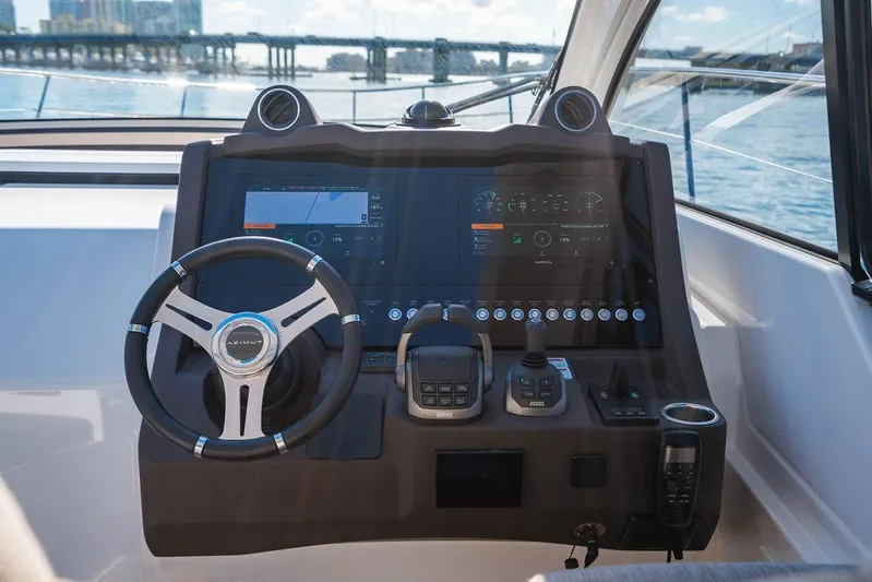 Relax Josephine Yacht Photos Pics 2022 Azimut Atlantis 45 yacht helm with advanced navigation system and steering wheel.