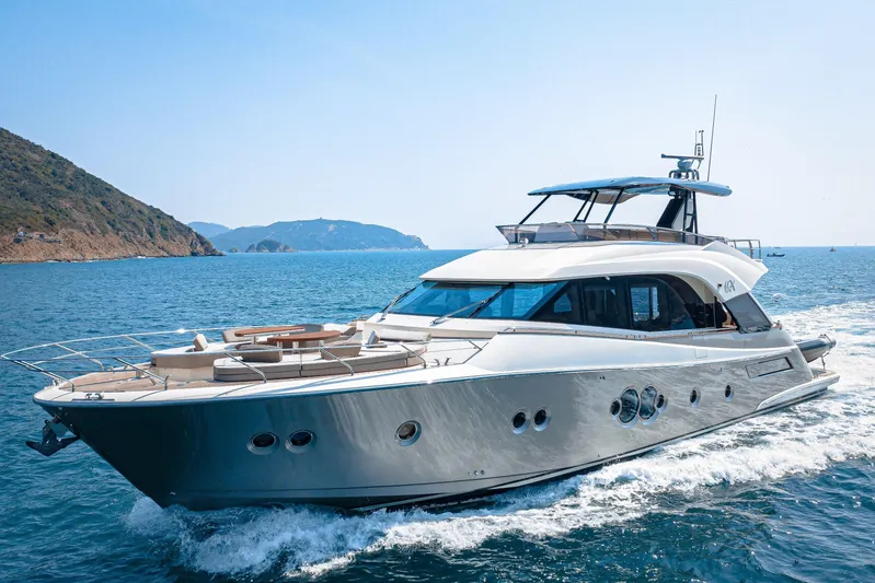 Mcy 70 Hk Yacht Photos Pics Luxurious 2014 Monte Carlo Yachts MCY 70 cruising on open sea near scenic coastline.