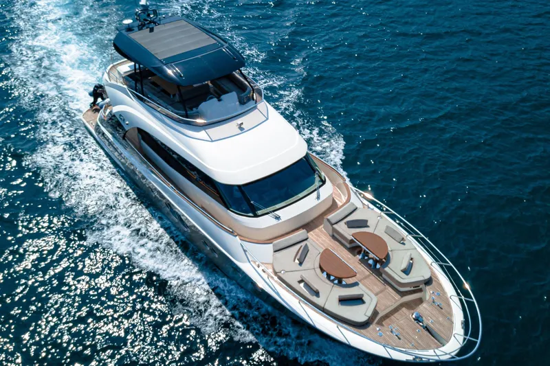 Mcy 70 Hk Yacht Photos Pics Luxurious 2014 Monte Carlo Yachts MCY 70 cruising on open blue waters.