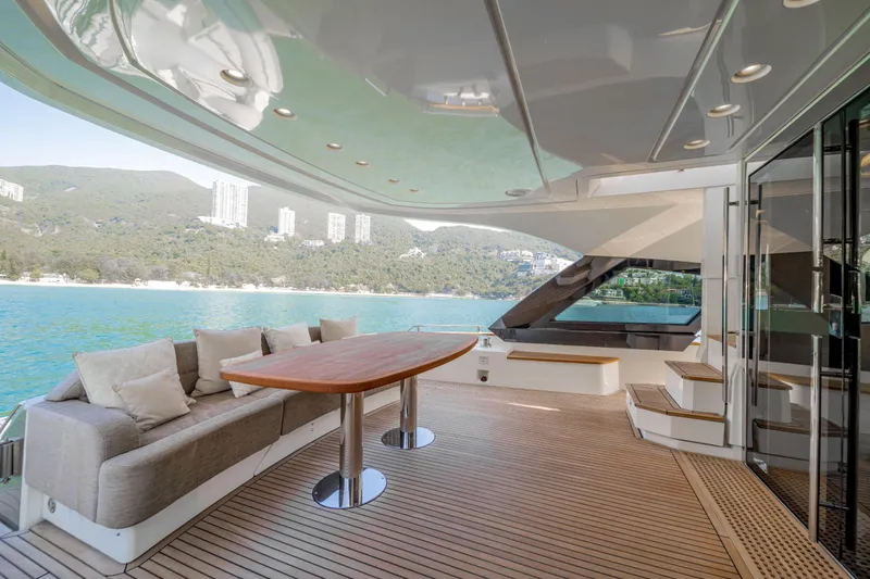 Mcy 70 Hk Yacht Photos Pics Luxurious 2014 Monte Carlo Yachts MCY 70 deck with elegant seating and scenic ocean view.