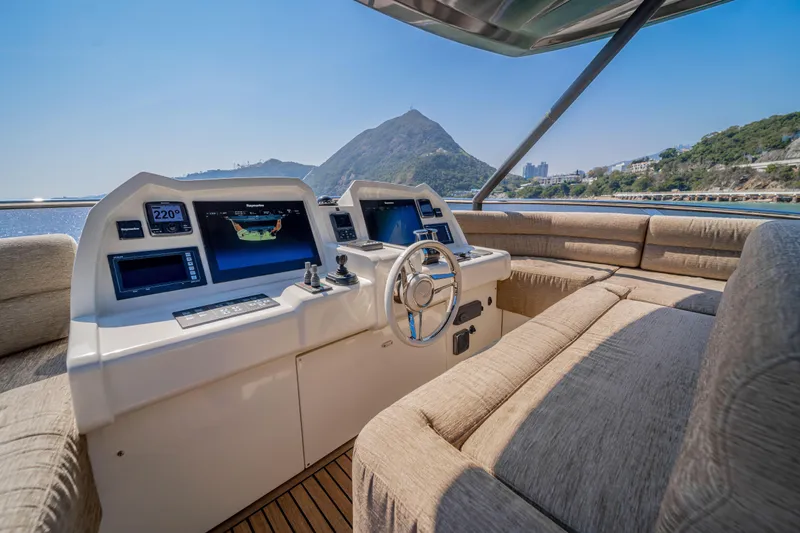 Mcy 70 Hk Yacht Photos Pics Luxurious 2014 Monte Carlo Yachts MCY 70 helm with scenic ocean and mountain view.