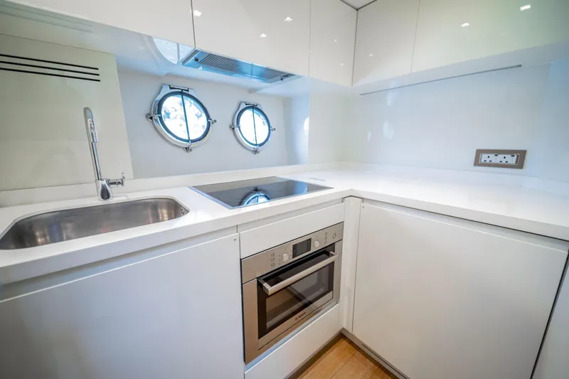 Mcy 70 Hk Yacht Photos Pics Modern kitchen in 2014 Monte Carlo Yachts MCY 70 with sleek design and porthole windows.