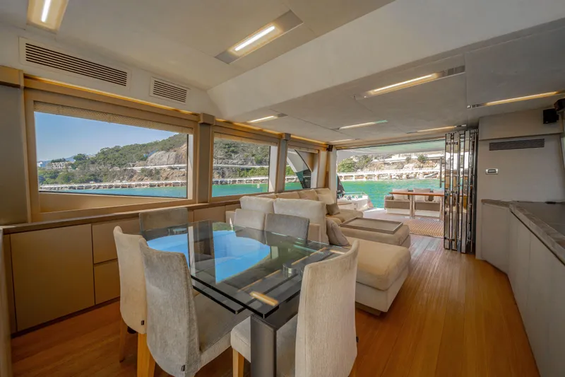 Mcy 70 Hk Yacht Photos Pics Luxurious interior of 2014 Monte Carlo Yachts MCY 70 with scenic ocean view.