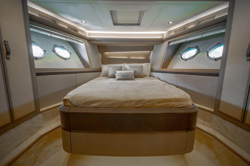 Mcy 70 Hk Yacht Photos Pics Luxurious bedroom interior of 2014 Monte Carlo Yachts MCY 70 with elegant design and porthole windows.