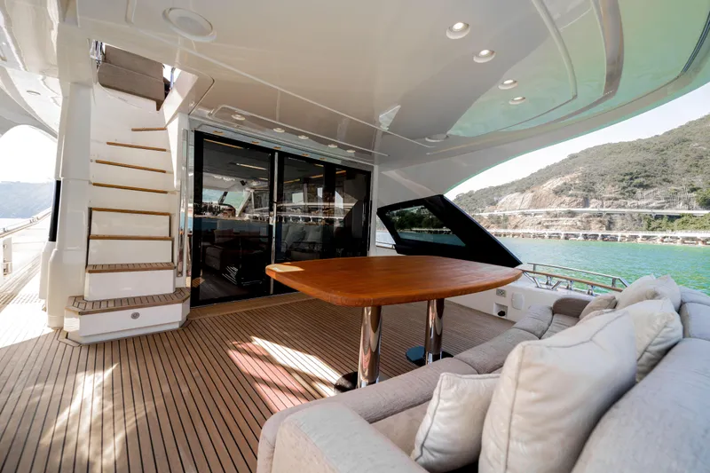 Mcy 70 Hk Yacht Photos Pics Luxurious 2014 Monte Carlo Yachts MCY 70 deck with elegant seating and scenic views.