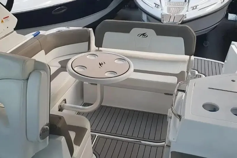  Yacht Photos Pics 2017 Monterey 295 Sport Yacht interior with seating and table, showcasing luxury design.