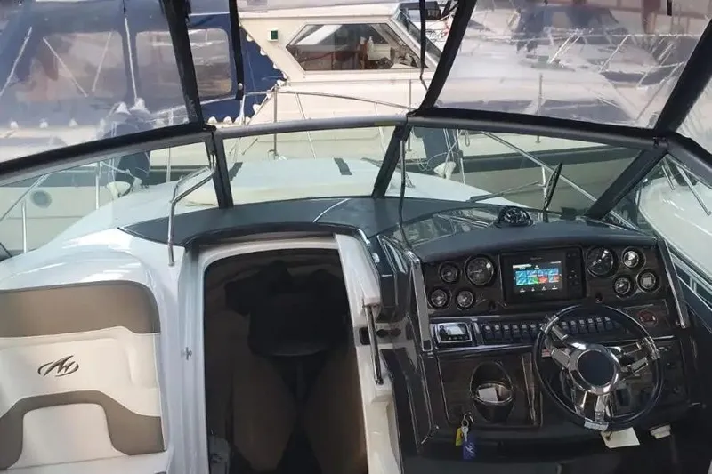  Yacht Photos Pics 2017 Monterey 295 Sport Yacht cockpit with modern dashboard and steering wheel.