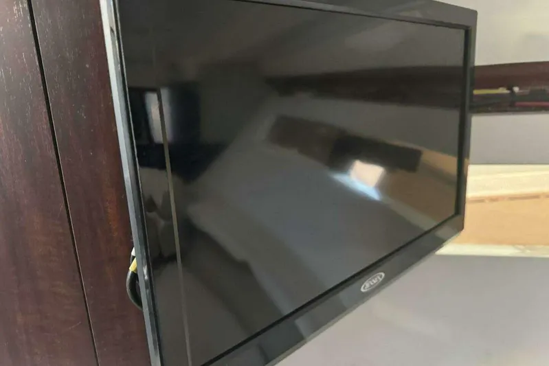  Yacht Photos Pics Flat-screen TV mounted on a 2017 Monterey 295 Sport Yacht interior.