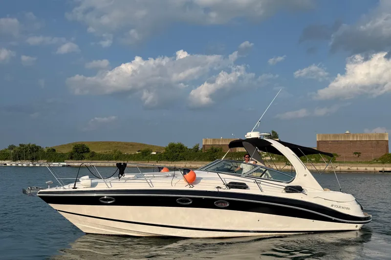  Yacht Photos Pics 2008 Four Winns V358 boat cruising on a sunny day with clear skies.