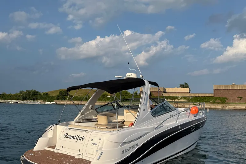  Yacht Photos Pics 2008 Four Winns V358 boat docked on a sunny day with clear skies.