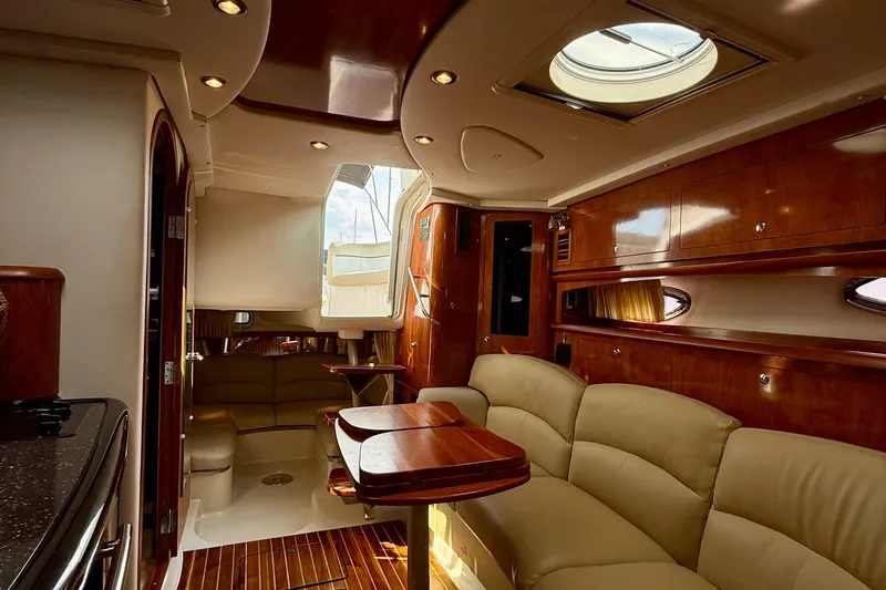 Yacht Photos Pics Luxurious interior of 2008 Four Winns V358 yacht with elegant wood finishes.