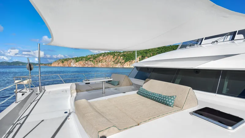 Sea Glass Yacht Photos Pics Luxurious 2018 Horizon PC74 yacht deck with sun loungers and ocean view.