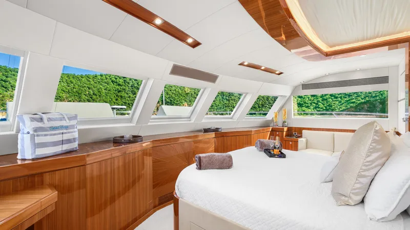 Sea Glass Yacht Photos Pics Luxurious Horizon PC74 yacht interior with panoramic windows and elegant wood finishes, 2018 model.