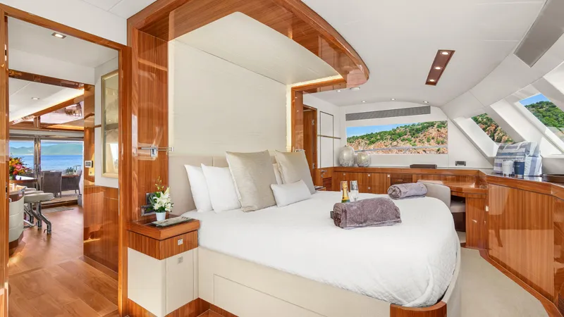 Sea Glass Yacht Photos Pics Luxurious bedroom interior on 2018 Horizon PC74 yacht with scenic ocean view.