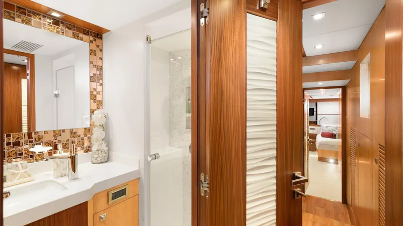 Sea Glass Yacht Photos Pics Luxurious bathroom interior on 2018 Horizon PC74 yacht with modern wood accents.