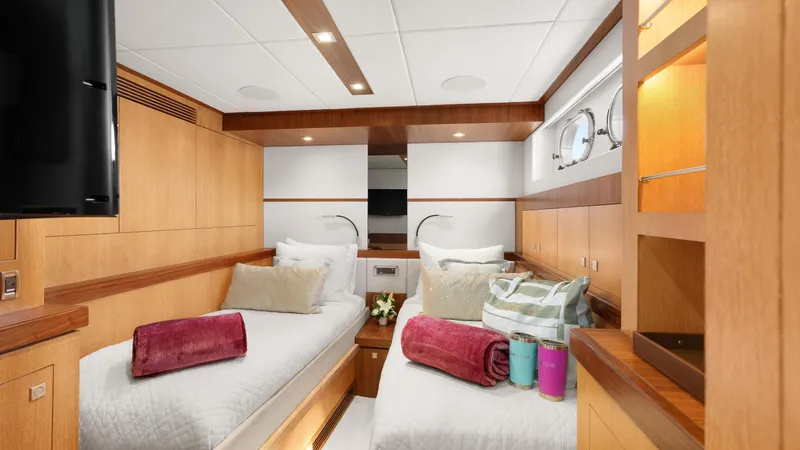 Sea Glass Yacht Photos Pics Luxurious cabin interior of 2018 Horizon PC74 yacht with twin beds and elegant decor.