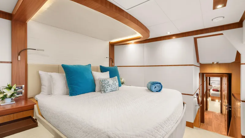 Sea Glass Yacht Photos Pics Luxurious bedroom interior on 2018 Horizon PC74 yacht with elegant bedding and modern design.