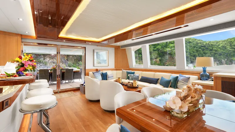 Sea Glass Yacht Photos Pics Luxurious interior of 2018 Horizon PC74 yacht with elegant seating and scenic views.