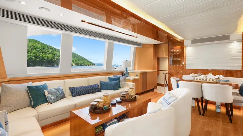 Sea Glass Yacht Photos Pics Luxurious Horizon PC74 yacht interior with elegant seating and scenic ocean views, 2018 model.