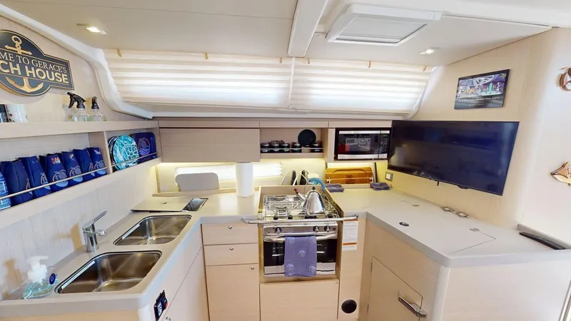 Evelyn Yacht Photos Pics Interior of 2021 Beneteau Oceanis 40.1 yacht kitchen with modern amenities and sleek design.