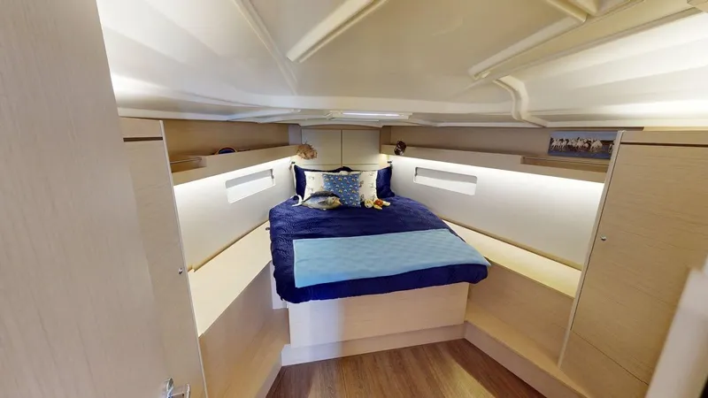Evelyn Yacht Photos Pics Luxurious cabin interior of 2021 Beneteau Oceanis 40.1 yacht with cozy bedding.