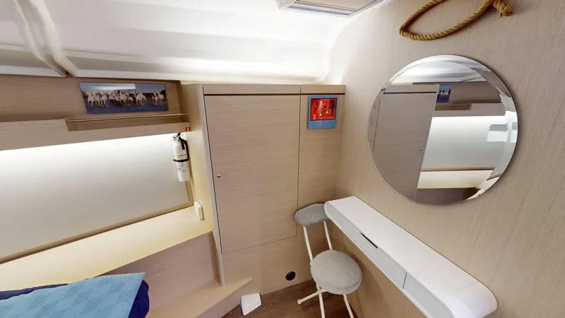 Evelyn Yacht Photos Pics Interior of 2021 Beneteau Oceanis 40.1 yacht cabin with mirror and seating area.