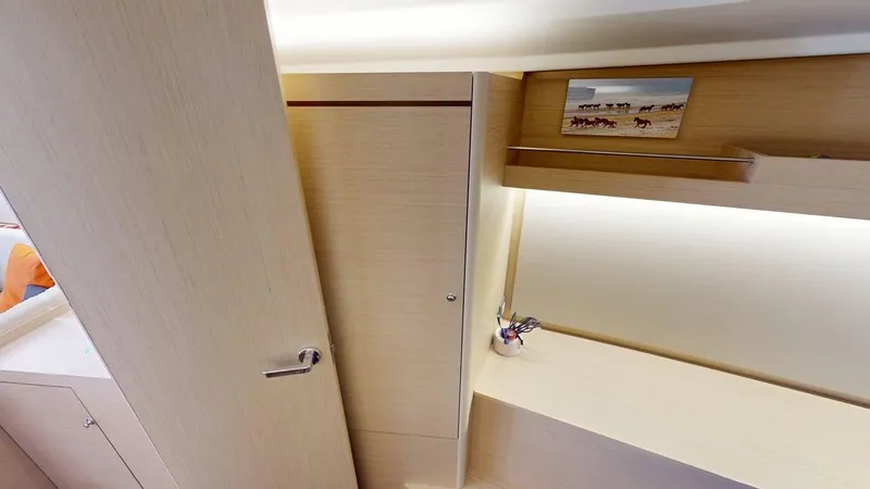 Evelyn Yacht Photos Pics Interior of 2021 Beneteau Oceanis 40.1 yacht, featuring light wood cabinetry and modern design.