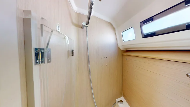 Evelyn Yacht Photos Pics Beneteau Oceanis 40.1 2021 yacht bathroom with wooden paneling and modern fixtures.