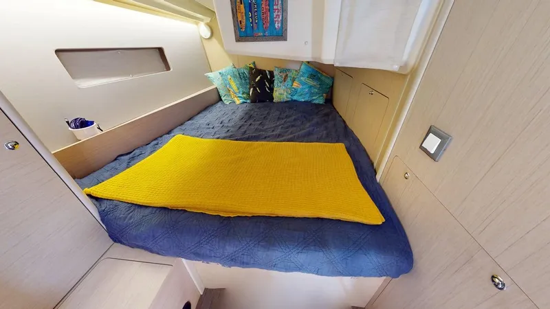 Evelyn Yacht Photos Pics Cozy cabin interior of 2021 Beneteau Oceanis 40.1 with colorful bedding and modern decor.