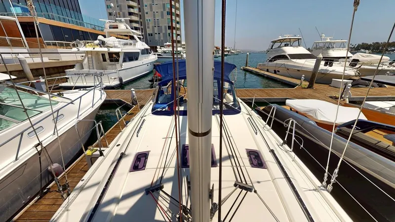 Evelyn Yacht Photos Pics Beneteau Oceanis 40.1 sailboat docked at marina, surrounded by other boats, 2021 model.