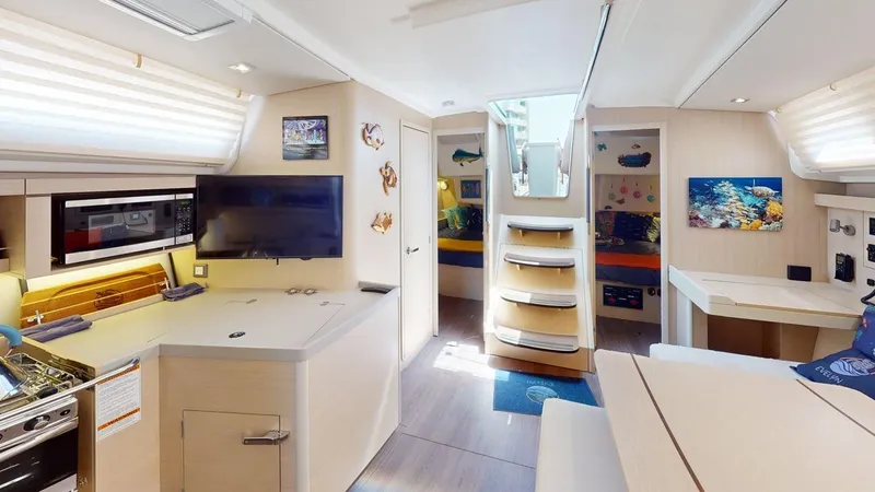 Evelyn Yacht Photos Pics Interior of 2021 Beneteau Oceanis 40.1 yacht, featuring modern kitchen and cozy living area.
