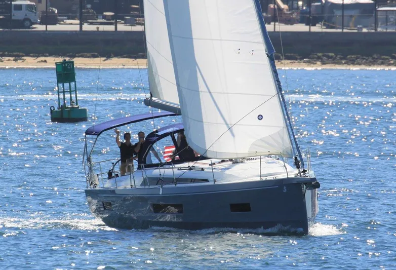 Evelyn Yacht Photos Pics 2021 Beneteau Oceanis 40.1 sailing on open water with people onboard.