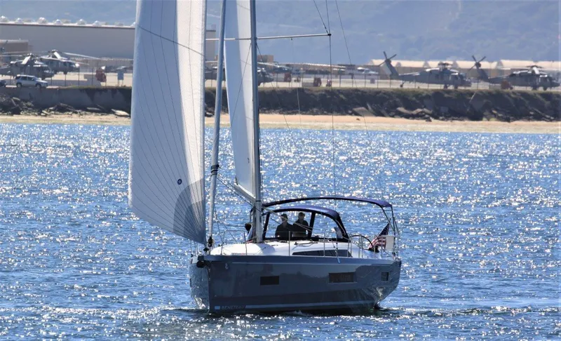 Evelyn Yacht Photos Pics 2021 Beneteau Oceanis 40.1 sailing on a sunny day near the coast.