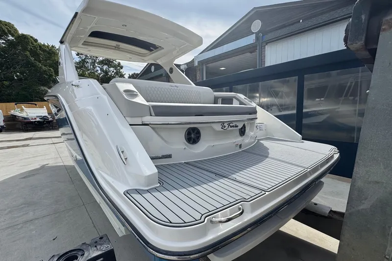  Yacht Photos Pics 2021 Sea Ray 310 SLX boat with sleek design, docked outdoors.