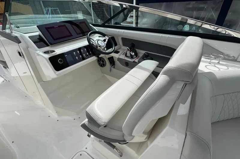  Yacht Photos Pics Luxurious interior of 2021 Sea Ray 310 SLX boat with modern dashboard and seating.