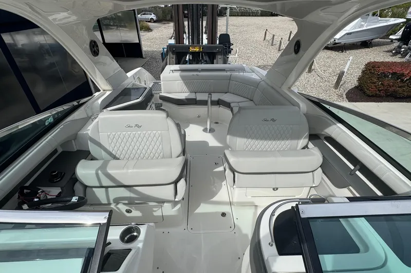  Yacht Photos Pics 2021 Sea Ray 310 SLX boat interior with luxurious white seating and modern design.