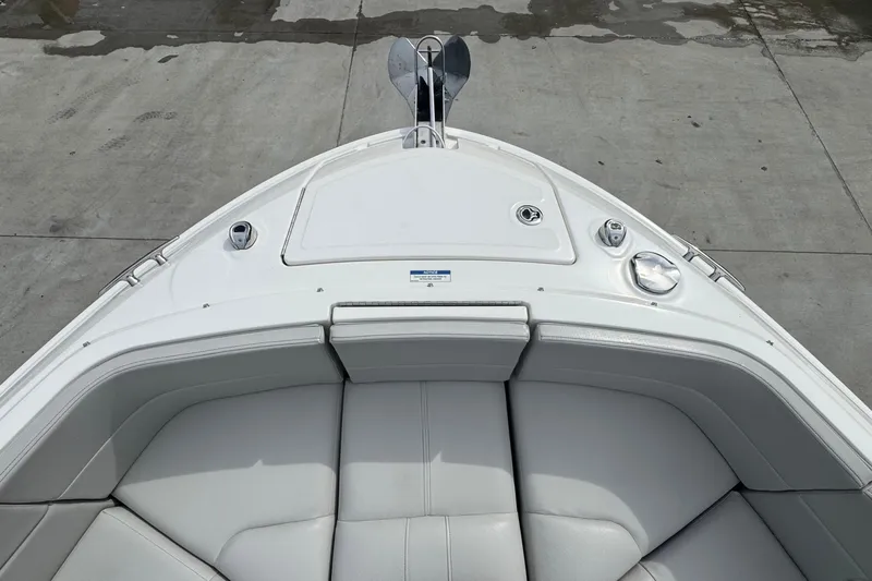  Yacht Photos Pics Bow view of 2021 Sea Ray 310 SLX boat with white seating and anchor.